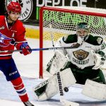 Silvertips goalie Mario Petit stops a shot at goal with Spokane&rsquo;s Hudson Elynuik, left, Wednesday night at Xfinity Arena in Everett on January 11, 2017. The Silvertips won 5-0. (Kevin Clark / The Herald)