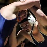 Arlington&rsquo;s Cooper McAuslan (left) battles Everett&rsquo;s Jake Leonard during a 182-pound match Thursday night at Everett High School. Arlington won 41-30. (Kevin Clark / The Herald)
