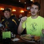 Zach Mulalley, 18, and his father, Rob, talk rowing at the Buzz Inn Steakhouse in Lake Stevens. (Ian Terry / The Herald)