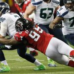 Falcons defensive tackle Jonathan Babineaux (95) sacks Seahawks quarterback Russell Wilson (3) during the second half of a playoff game Saturday in Atlanta. The Falcons won 36-20. (AP Photo/John Bazemore)