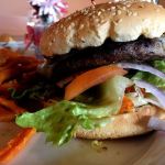 Ben Watanabe / The Herald                                A cheeseburger at Le Bistro is topped with your choice of cheese, mayonnaise, lettuce, tomato, mustard and red onions for $6.