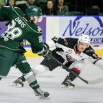 Everett&rsquo;s Kevin Davis attempts a shot with the Giants&rsquo; Brendan Semchuk defending during a game on Sept. 24 in Everett. (Kevin Clark / The Herald)