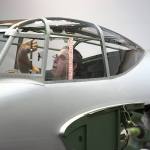 Chris Wood, the Flying Heritage Collection aircraft mechanic, removes the escape hatch in the cockpit of a de Havilland Mosquito, a World War II attack aircraft. (Andy Bronson / The Herald)