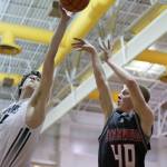 Edmonds-Woodway&rsquo;s Joe Cooper (left) blocks a shot by Stanwood&rsquo;s Trygve DeBoer as Stanwood beat Edmonds-Woodway 85-66 in a boys basketball game Tuesday at Edmonds-Woodway High School in Edmonds. (Andy Bronson / The Herald)