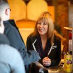 Vicki Evola, co-owner of Brooklyn Bros. Pizzeria, works the counter at the downtown Everett site. She likes to work the front counter, especially after events at Xfinity Arena, to get a feel for her customers. (Kevin Clark / The Herald)