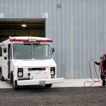 Debra Draper fills the watertank during her weekly maintenance on SSAR 70. (Kevin Clark / The Herald)