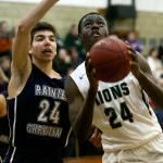 Hunter Whitchurch of Rainier Christian defends and trails Erwin Weary of Cedar Park Christian Thursday night at Cedar Park Christian School in Mountlake Terrace on December 29, 2016. (Kevin Clark / The Herald)