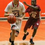 Monroe&rsquo;s Trenton Newhouse controls the ball with Cascade&rsquo;s Musa Baldeh trailing Thursday night in Monroe on January 12, 2017. The Bearcats won 57-43. (Kevin Clark / The Herald)