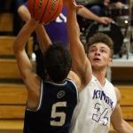 Glacier Peak&rsquo;s Justin Purcell attempts a shot over Kamiak&rsquo;s Daniel Sharpe during a game Friday night at Kamiak High School in Mukilteo. The Grizzles won 63-50. (Kevin Clark / The Herald)
