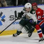 Everett&rsquo;s Patrick Bajkov holds off Spokane&rsquo;s Ty Smith during the Silvertips&rsquo; 5-0 win over the Chiefs on Wednesday night at Xfinity Arena in Everett. (Kevin Clark / The Herald)