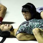 Jackson&rsquo;s Cristian Wilson is pinned by Kamiak&rsquo;s Peter Kim during a match Friday night at Jackson High School in Mill Creek. Kamiak won 47-35. (Kevin Clark / The Herald)
