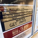 A board listing current cruise ship vacation deals is seen at an Expedia CruiseShipCenters franchise in Mill Creekճ Town Center. (Ian Terry / The Herald)