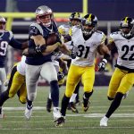 New England Patriots wide receiver Chris Hogan (15) runs by the Pittsburgh Steelers defense during the second half of the AFC championship. (AP Photo/Elise Amendola)