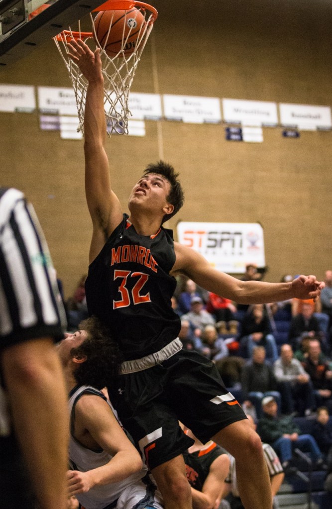 Monroe&rsquo;s Spencer Davidson goes up for a rebounds but the ball is already through the net during a game against Glacier Peak on Tuesday. Glacier Peak beat Monroe 56-46. (Daniella Beccaria / The Herald)