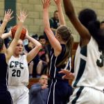 Jennifer Perekopskaya of Cedar Park Christian (20) looks to pass as teammate Salome Yosef (3) posts up during a game Thursday against Rainier Christian. (Kevin Clark / The Herald)