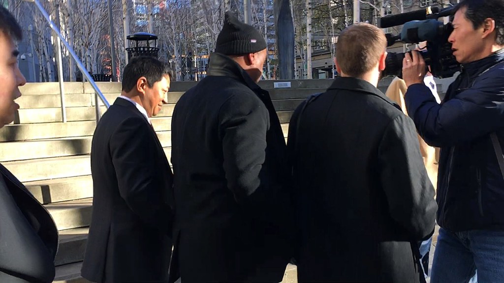 Lobsang Dargey leaves the U.S. District Court building after his hearing in Seattle on Wednesday, Jan. 4. (Dan Catchpole / Everett Herald)