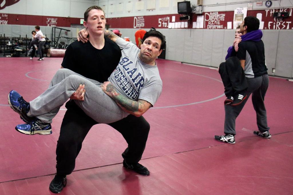 Cascade&rsquo;s Adam Holston carries his coach, Brooklyn Obregon, in strength drills during practice at Cascade High on Jan. 18. After the death of his father, Jery, in June of 2016, Holston moved in with Obregon and his wife, Cindy. (Kevin Clark / The Herald)