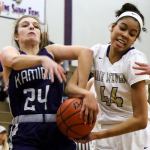 Kamiak&rsquo;s Jamie Beirne (left) and Lake Stevens&rsquo; Kylee Griffen struggle for control of a rebound Wednesday night in Lake Stevens. The Vikings won 65-61. (Kevin Clark / The Herald)