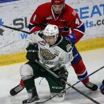 Everett&rsquo;s Matt Fonteyne vies for control of the puck with Spokane&rsquo;s Jeff Faith on his back during the Silvertips&rsquo; 5-0 win over the Chiefs on Wednesday night at Xfinity Arena in Everett. (Kevin Clark / The Herald)