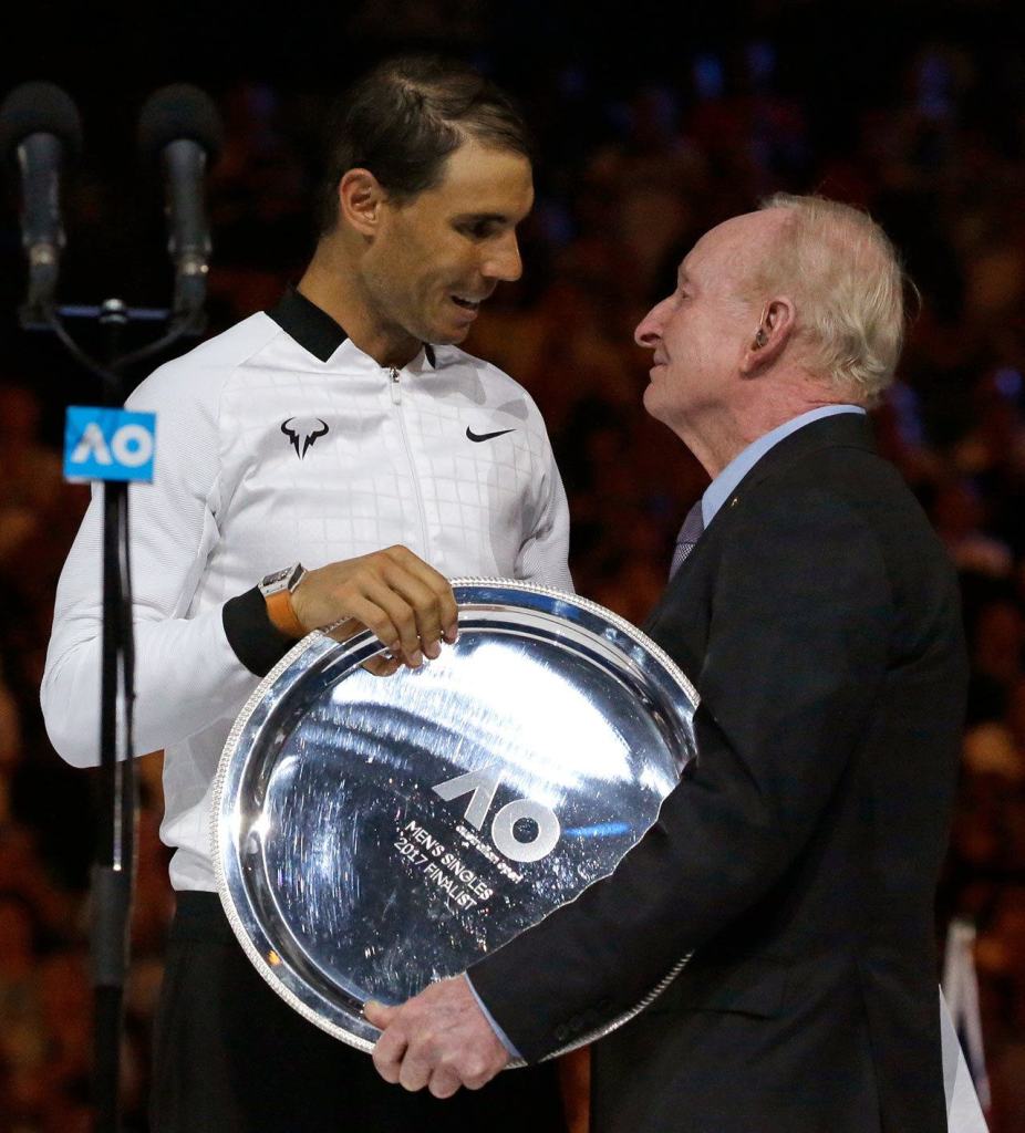 Spain&rsquo;s Rafael Nadal, left, receives runner-up trophy from Rod Laver after losing to Switzerland&rsquo;s Roger Federer during the men&rsquo;s singles final at the Australian Open tennis championships in Melbourne, Australia, Sunday, Jan. 29, 2017. (AP Photo/Aaron Favila)