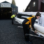 Club member Ben Wilson (center right) puts away a shell following practice. (Ian Terry / The Herald)
