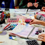 Using a variety of tools and media, women express themselves through visual journaling last week at ArtWorks in Edmonds. (Dan Bates / The Herald)