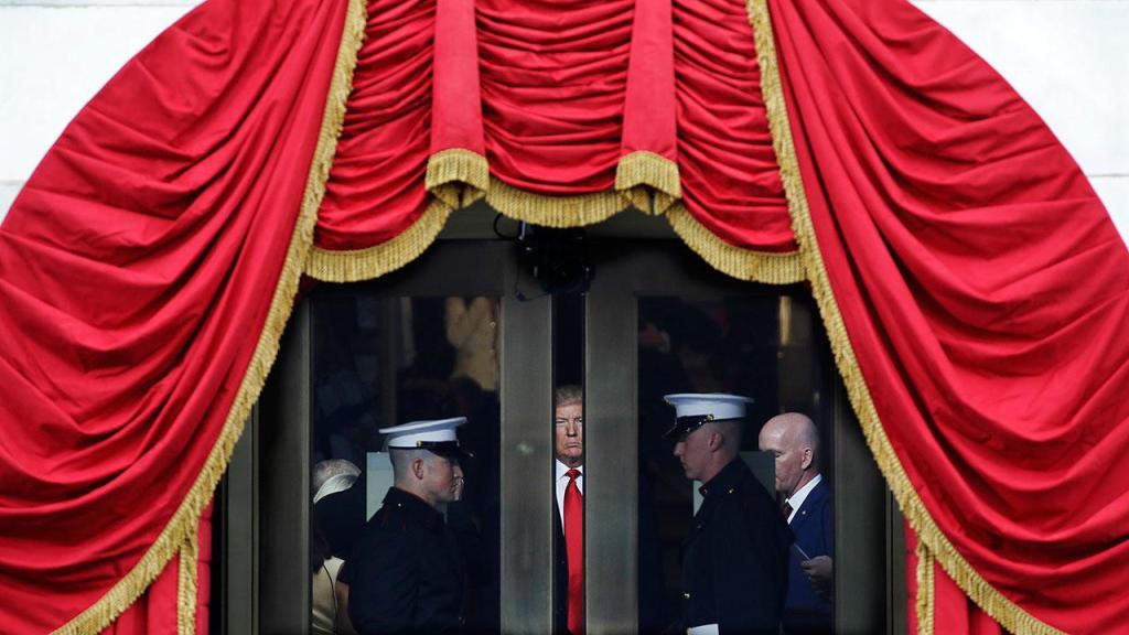 President-elect Donald Trump waits to step out onto the portico for his Presidential Inauguration at the U.S. Capitol in Washington on Friday, Jan. 20. (AP Photo/Patrick Semansky)