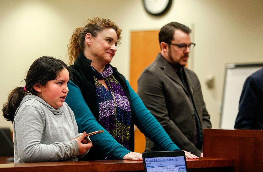 Standing with victim advocate Renee Sewell (center), 9-year-old Gaby Becktell (left), Scotty Becktell&rsquo;s niece, speaks to Judge Millie Judge on Tuesday, and tells her that the driver (Scott Duncan at right) needs to go to jail until he learns his lesson. (Dan Bates / The Herald)
