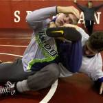Stanwood&rsquo;s Mason Phillips (left) and Riley Van Scoy wrestle during practice on Jan. 5 at Stanwood High School. (Kevin Clark / The Herald)