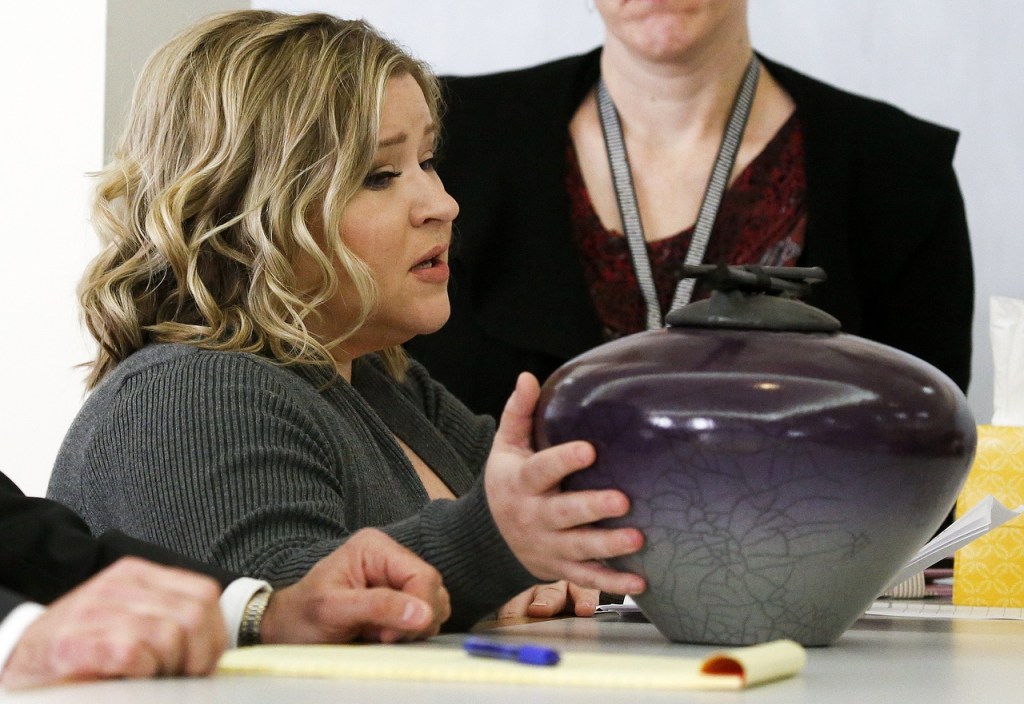Mukilteo shooting victim Jacob Long&rsquo;s mother Autumn Snider addresses the court with an urn containing her son&rsquo;s ashes during a sentencing hearing for shooter Allen Ivanov in Everett on Thursday, Jan. 12. (Ian Terry / The Herald)