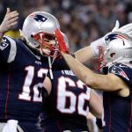 New England Patriots quarterback Tom Brady (12) celebrates with wide receiver Julian Edelman (11) after throwing a touchdown pass. (AP Photo/Matt Slocum)