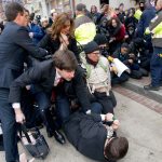 Inaugural attendees move through demonstrators attempting to block people entering a security checkpoint Friday, Jan. 20, ahead of President-elect Donald Trump&rsquo;s inauguration in Washington. (AP Photo/Jose Luis Magana)