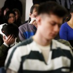 Members of the Bui family are overcome with emotion during the sentencing hearing for Mukilteo shooter Allen Ivanov in Everett on Thursday, Jan. 12. Ivanov was sentenced to life in prison for opening fire and killing three and wounding others at a Mukilteo party in July. (Ian Terry / The Herald)