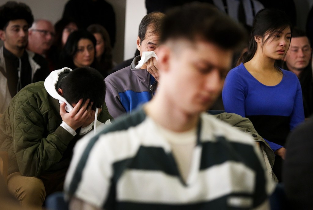 Members of the Bui family are overcome with emotion during the sentencing hearing for Mukilteo shooter Allen Ivanov in Everett on Thursday, Jan. 12. Ivanov was sentenced to life in prison for opening fire and killing three and wounding others at a Mukilteo party in July. (Ian Terry / The Herald)