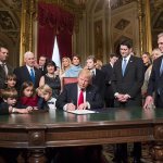 President Donald Trump is joined by the Congressional leadership and his family as he formally signs his cabinet nominations into law Friday, Jan. 20, in the President&rsquo;s Room of the Senate on Capitol Hill in Washington. From left are, Senate Majority Leader Mitch McConnell, Sen. Roy Blunt, Donald Trump Jr., Vice President Mike Pence, Jared Kushner, Karen Pence, Ivanka Trump, Melania Trump, Barron Trump, Speaker of the House Paul Ryan, Majority Leader Kevin McCarthy and House Minority Leader Nancy Pelosi. (AP Photo/J. Scott Applewhite, Pool)