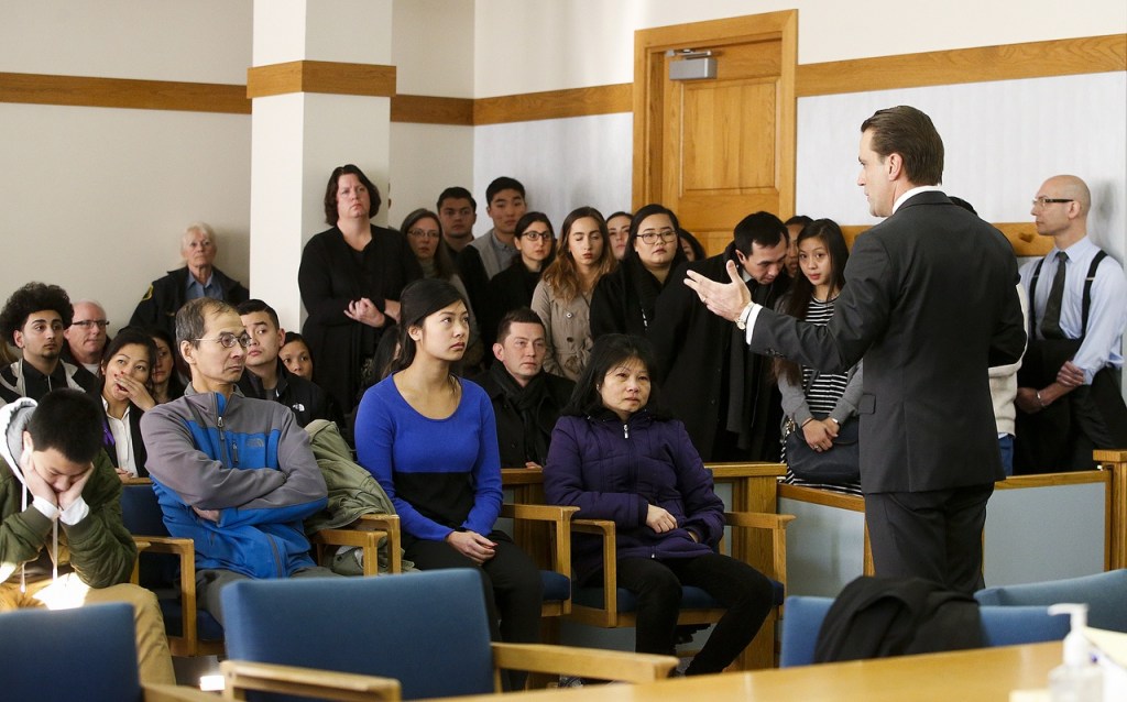 Snohomish County Deputy prosecutor Adam Cornell (right) addresses a packed courtroom in Everett before the sentencing hearing for Mukilteo shooter Allen Ivanov on Thursday, Jan. 12. (Ian Terry / The Herald)