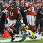 Atlanta Falcons&rsquo; Julio Jones catches a pass in front of Green Bay Packers&rsquo; Damarious Randall and sprints for a long touchdown run during the second half of the NFC championship game Sunday, Jan. 22. (AP Photo/David Goldman)