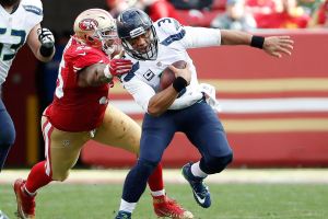 Seahawks’ Wilson insists he’s healthy, O-coordinator Bevell not so sure