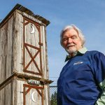 What&rsquo;s Up about the two-story Politician/Voter outhouse behind Rustic Cuts barbershop in Silver Lake? Barber Don Baird, 76, built the outhouse from barnwood he had leftover when he built his barbershop 6 years ago as a statement about how voters get dumped on. (Dan Bates / The Herald)