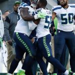 Seahawks defensive tackle Jarran Reed, left, is shoved by defensive end Frank Clark (55) during the second half of Sunday&rsquo;s game against 49ers in Santa Clara, California . (AP Photo/Tony Avelar)