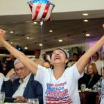 Julia del Rio cheers as she watches a televised broadcast of the presidential inauguration of Donald Trump during a watch party organized by Hispanas for Trump in Miami. (AP Photo/Lynne Sladky)