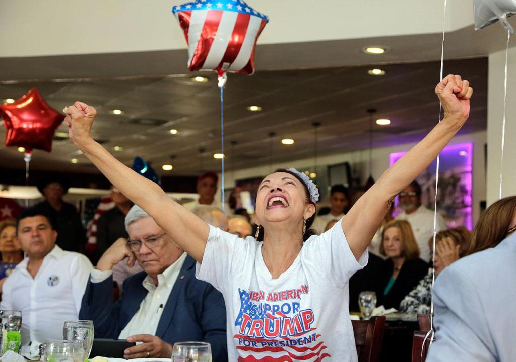 Julia del Rio cheers as she watches a televised broadcast of the presidential inauguration of Donald Trump during a watch party organized by Hispanas for Trump in Miami. (AP Photo/Lynne Sladky)