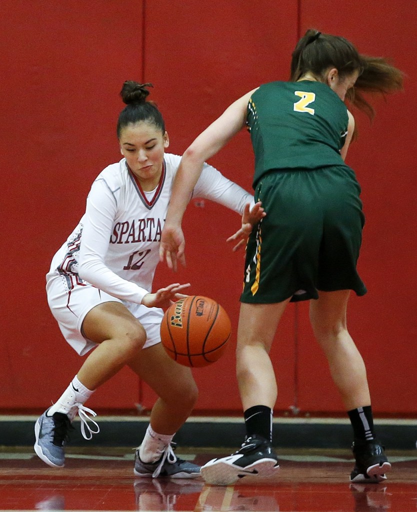 Stanwood&rsquo;s Kayla Frazier (12) steals the ball away from Shorecrest&rsquo;s Amanda Lee (2) during a 3A district playoff game on Feb. 10, 2017, at Stanwood High School. (Ian Terry / The Herald)