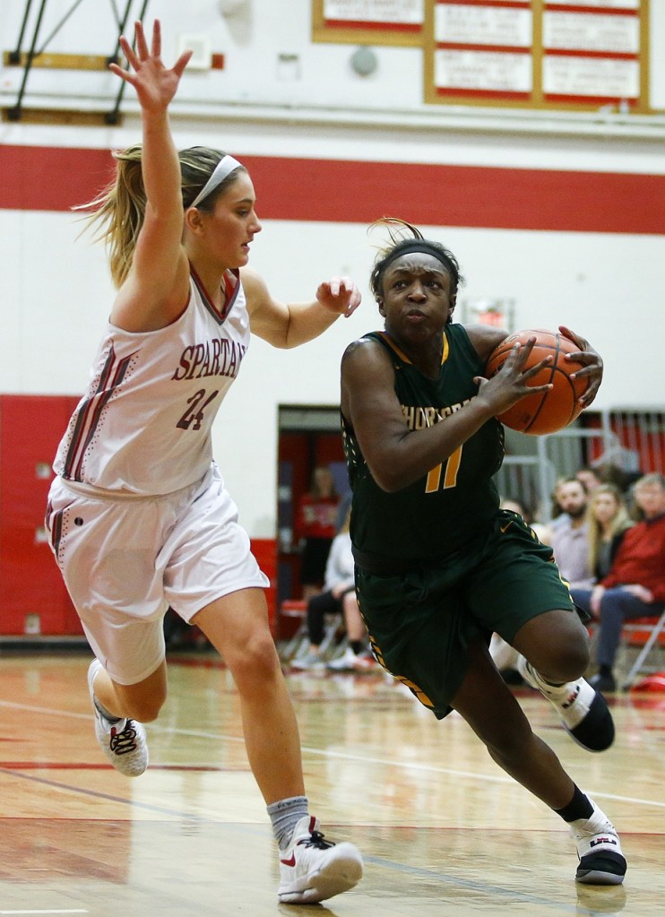 Shorecrest&rsquo;s Jazlyn Owens (right) drives to the hoop as Stanwood&rsquo;s Jillian Heichel defends during a 3A district playoff game on Feb. 10, 2017, at Stanwood High School. (Ian Terry / The Herald)