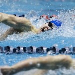Shorewood&rsquo;s Andrew Butcher (top) takes a breath as he swims the final length on the way to second place behind Bainbridge&rsquo;s Jude Wenker (bottom) in the 100-yard freestyle race at the 3A State Boys Swimming and Diving Championship at the King County Aquatic Center on Feb. 18, 2017. (Ian Terry / The Herald)