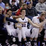 Gonzaga guard Nigel Williams-Goss, guard Silas Melson, forward Zach Collins, center Przemek Karnowski and guard Jordan Mathews, from left, celebrate on the bench during the second half of the team&rsquo;s win against Santa Clara in Spokane, Wash., Saturday, Feb. 4. (AP Photo/Young Kwak)