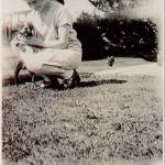 Longtime teacher and principal Frances Anderson in the 1930s, with her bobbed hair and smiling as she kneels to cuddle a dog, is part of a new photography exhibit, &ldquo;Edmonds in Focus.&rdquo; (Photo courtesy Edmonds Historical Museum)