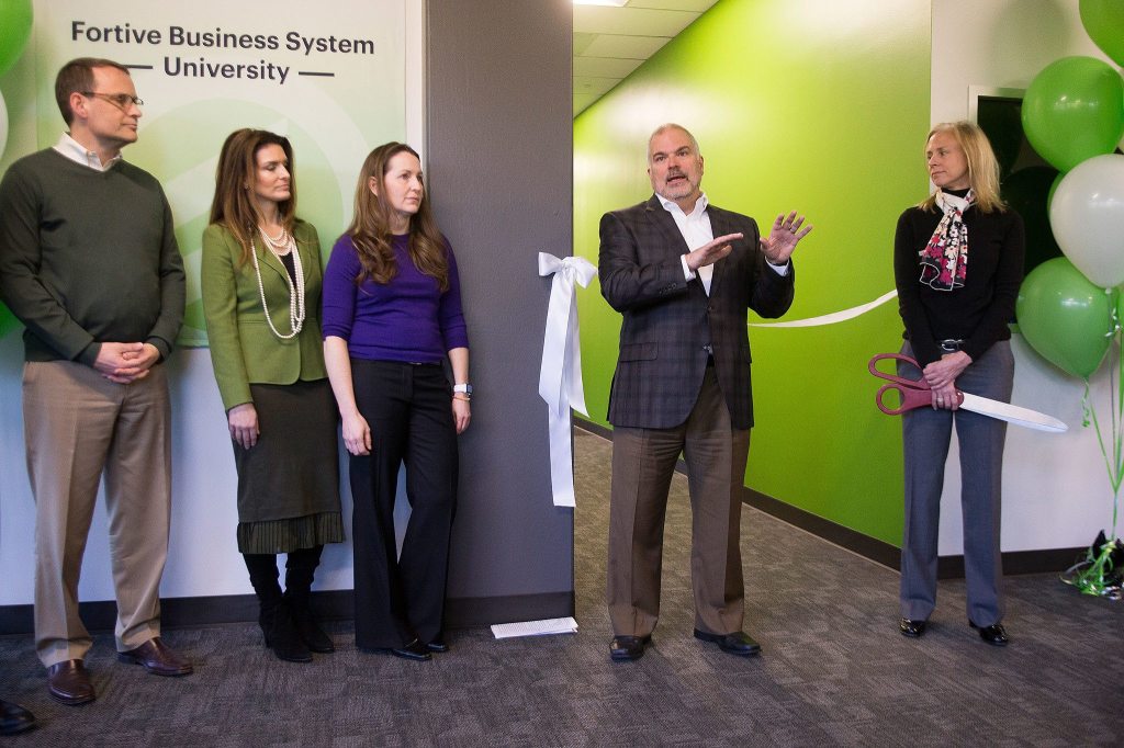 Fortive President and CEO Jim Lico talks to gathered employees before the ribbon cutting to open the FortiveBusiness System University last month. Fortive employees from all over North America will travel to the centerto train. (Andy Bronson / The Herald)