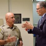 County Corrections Bureau Chief Tony Aston (left) and Gov. Jay Inslee talk at the Snohomish County Jail on Friday. (Snohomish County Sheriff&rsquo;s Office)