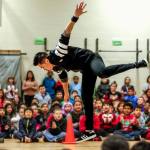 Breakdancer Jerome Aparis dazzles students with mid-air moves Feb. 3 at Emerson Elementary School. (Dan Bates / The Herald)